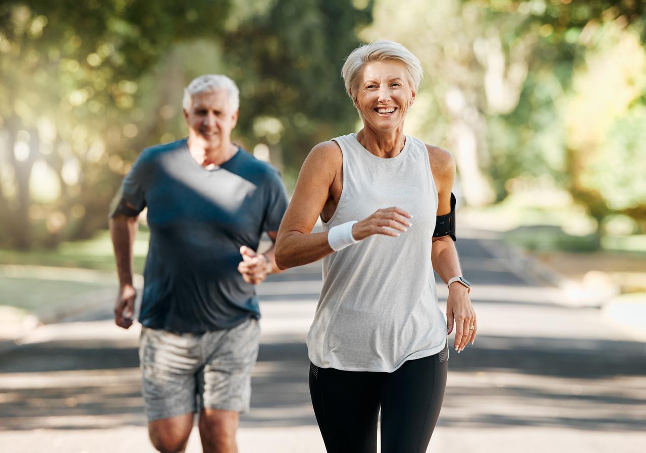 Two adults jogging outdoors together