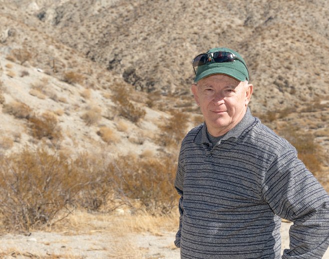 Man standing in desert landscape