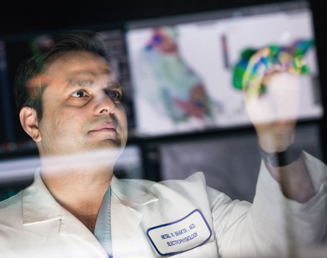 Physician reviewing digital heart scan on monitor