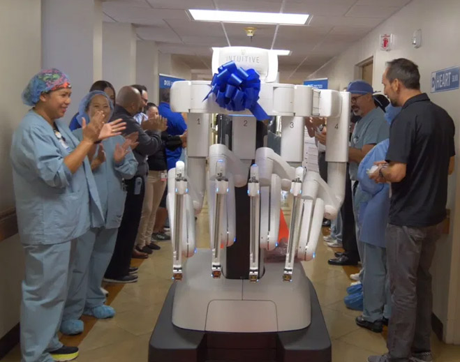 Medical staff unveiling surgical robot