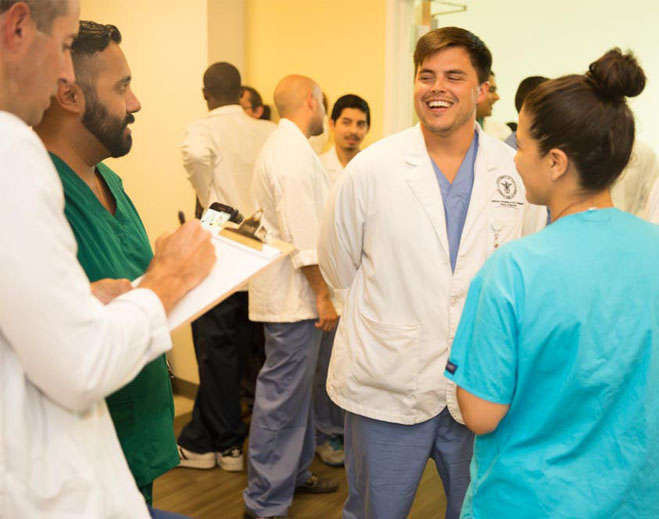 Healthcare team meeting in hallway