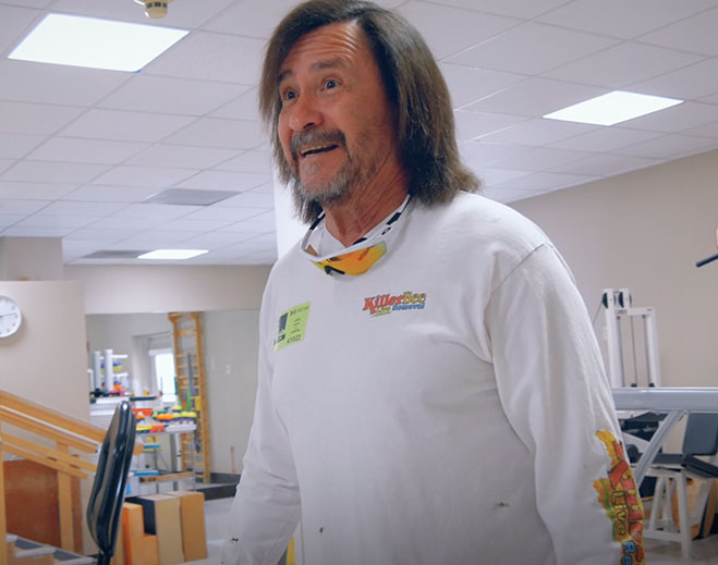 Man walking inside rehabilitation facility