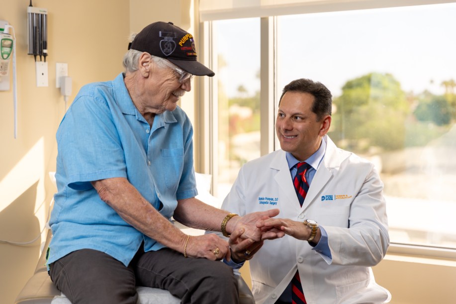orthopedic-care-bones Healthcare provider examining patient hand during checkup