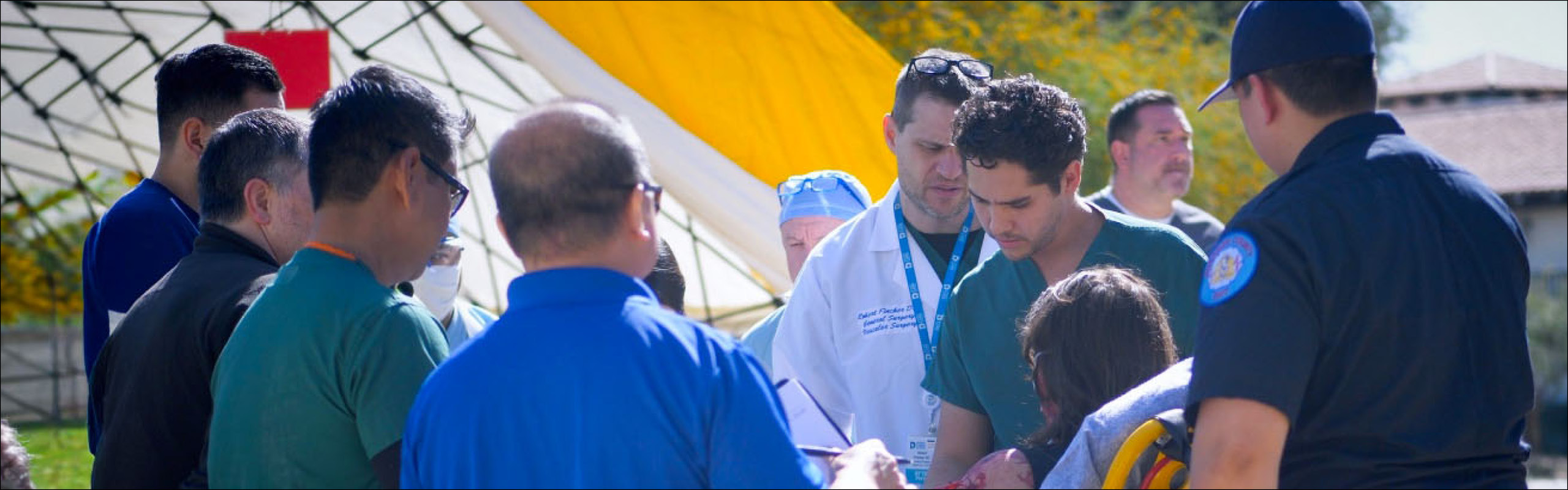 Emergency responders assisting injured patient outdoors